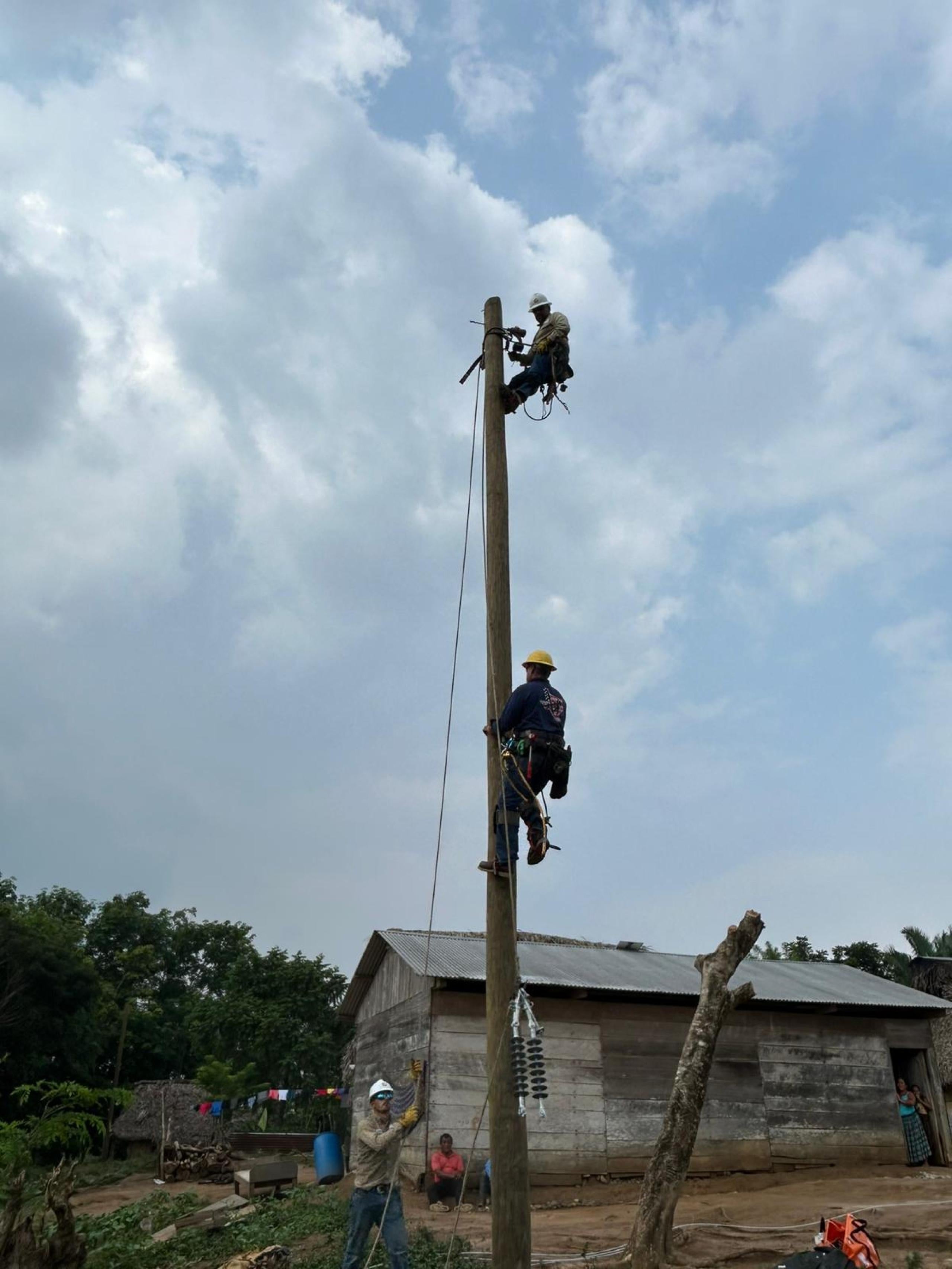 linemen on pole