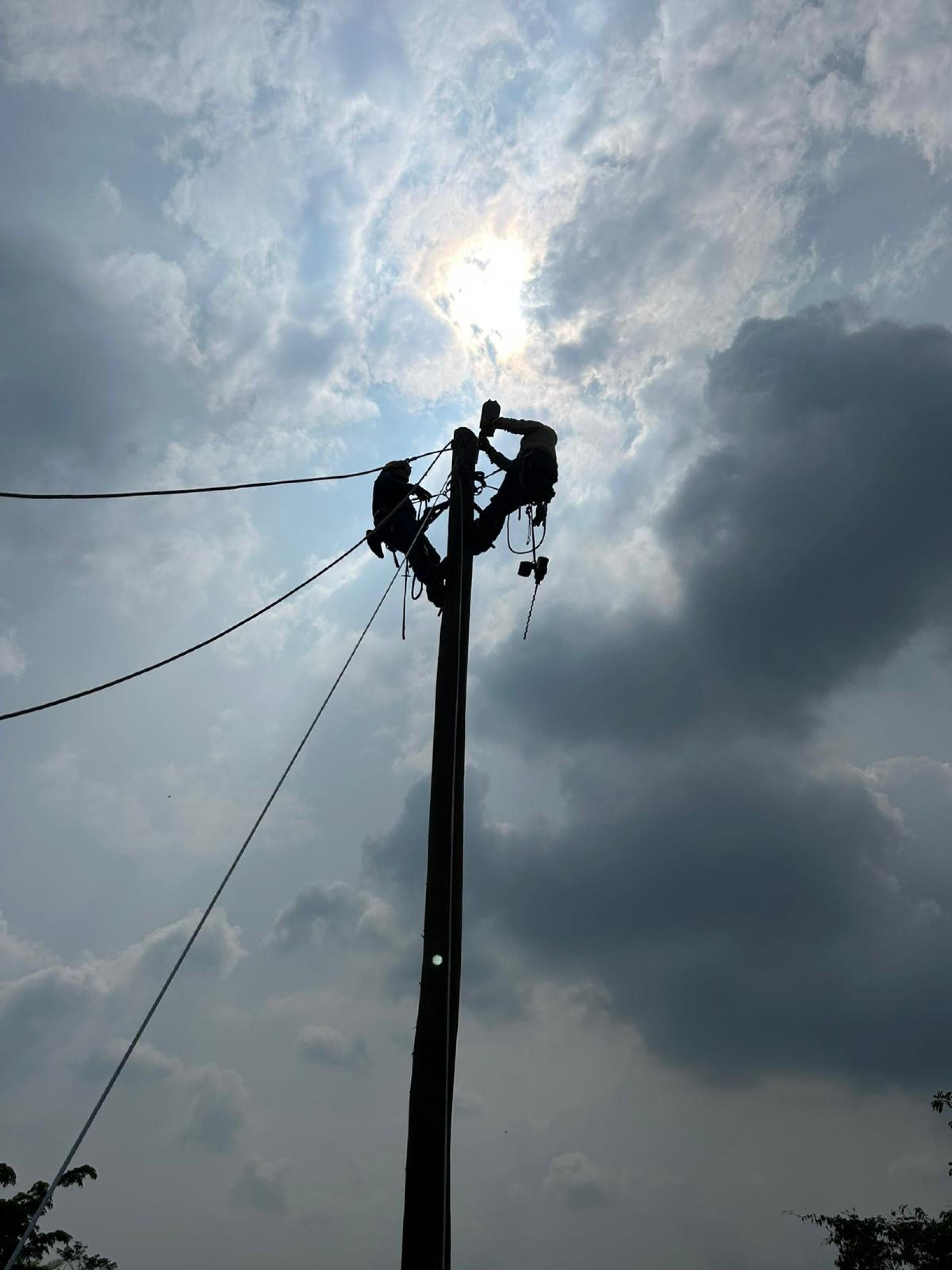 linemen on pole